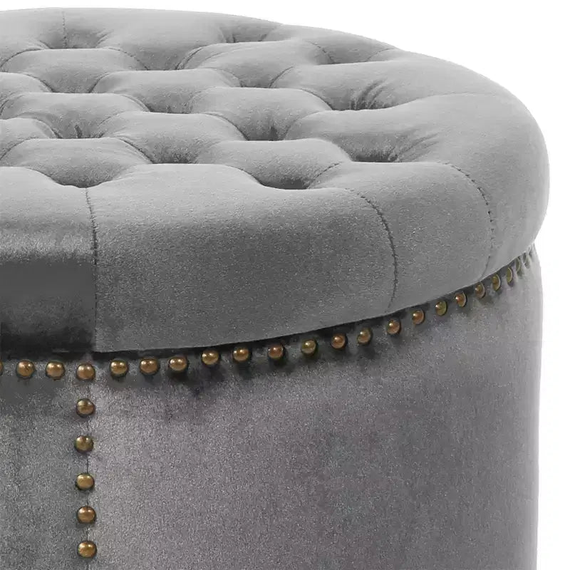 Ottoman rond contemporain en velours capitonné avec garniture cloutée