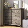 Bedroom vanity with intricately carved metal handles, featuring a tall cabinet with wooden legs. Suitable for bedrooms, living rooms, and hallways.